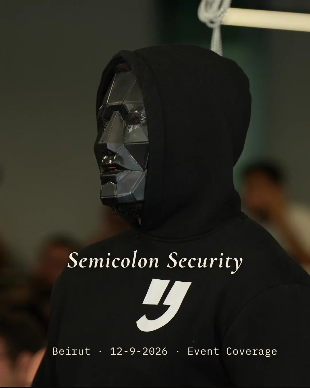 Masked figure in a black hoodie at the Semicolon Security event in Beirut